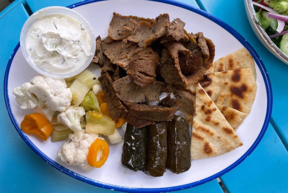 Ilios Crafted Greek’s lamb with grape leaves, vegetables and a side of tzatziki. Alex Cason/CharlotteFive