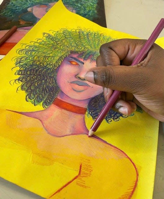 Young artist creating portraits