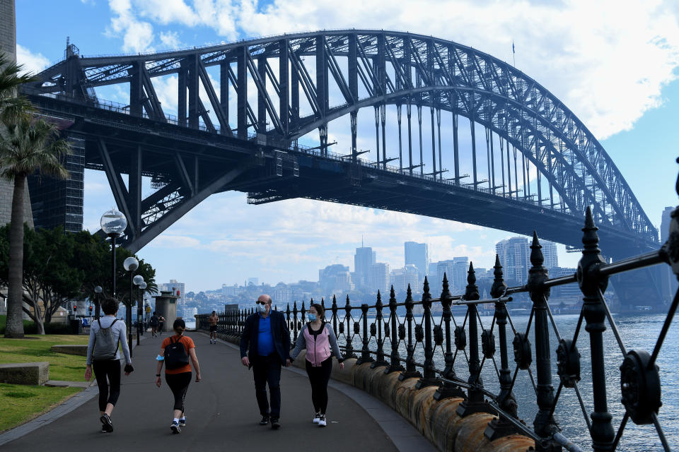 People wearing face masks near Sydney Harbour Bridge. Source: AAP Image