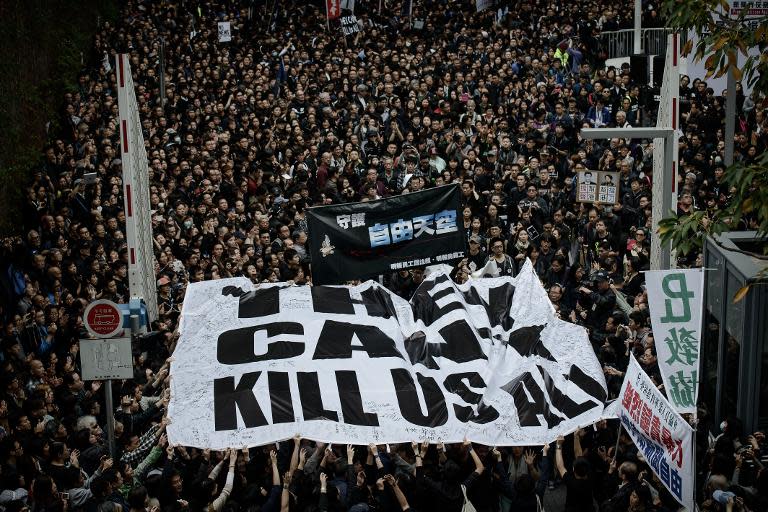 Protesters rally in support of press freedom in Hong Kong on March 2, 2014 following the attack on Kevin Lau, a former editor of liberal newspaper Ming Pao