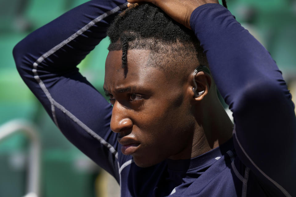 Eric Gregory prepares to run on the track at the U.S. Olympic Track and Field Trials, Wednesday, June 19, 2024, in Eugene, Oregon. The deaf sprinter from Gallaudet University earned the last spot into the 400-meter field at the U.S. Olympic Trials this week. (AP Photo/Charlie Neibergall)