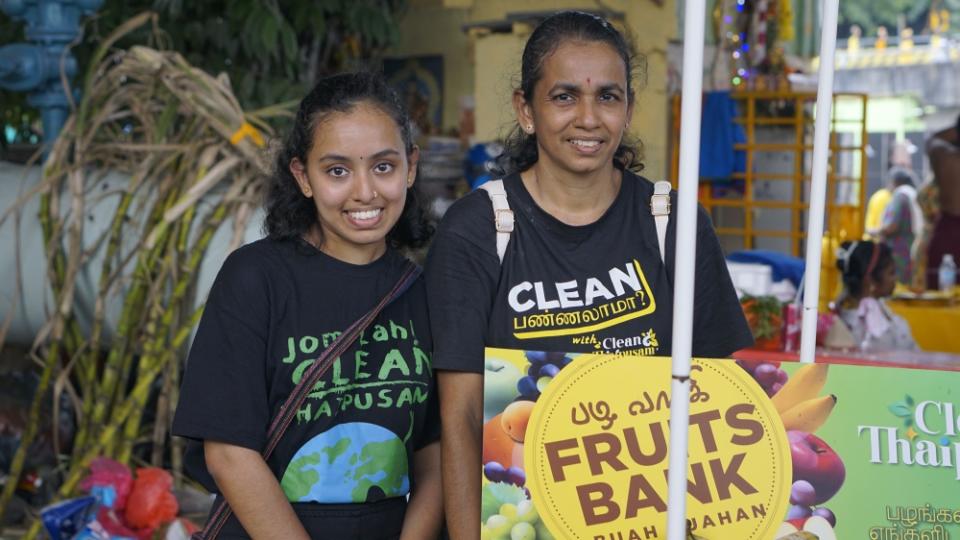 Sushmitaa Dhevii Monharan and her mother after their morning clean-up session at the riverbank across Batu Caves.— Picture by Arif Zikri