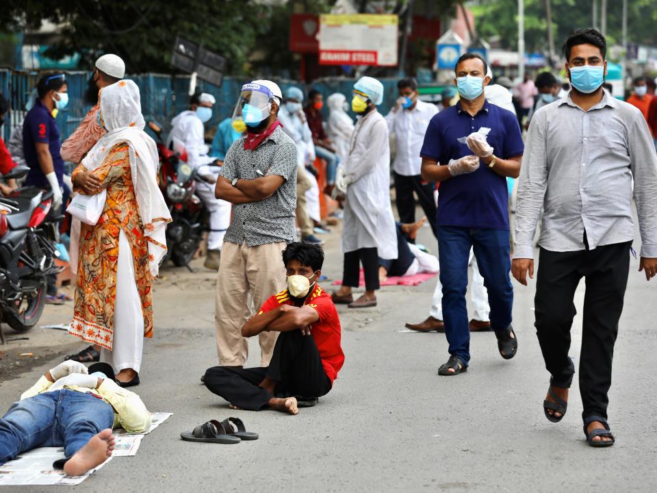 People wait in the queue outside of a coronavirus testing center amid concerns over coronavirus disease (COVID-19) outbreak in Dhaka, Bangladesh, May 17, 2020. REUTERS/Mohammad Ponir Hossain