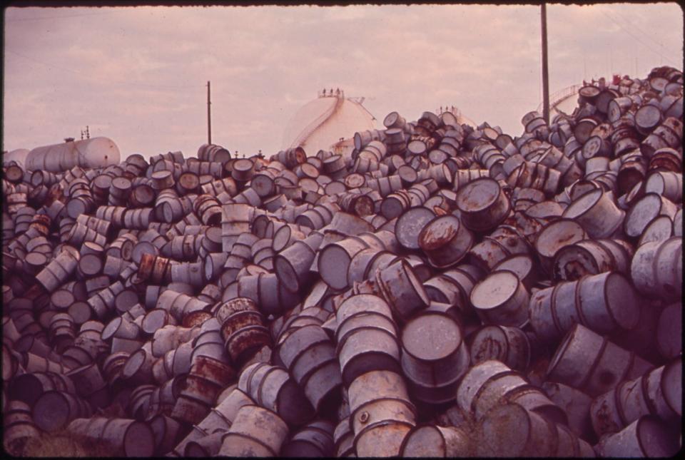 A mound of oil drums near the Baton Rouge ExxonMobil Refinery along the Mississippi River in December 1972.