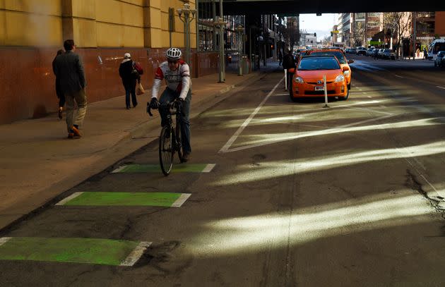 A cyclist rides down a parking-protected bike lane in Denver on Dec. 3, 2015. Because of Republican state lawmakers, Pennsylvania cyclists most likely will not get their parking-protected bike lanes, a common-sense measure that could potentially save lives. (Photo: RJ Sangosti/The Denver Post via Getty Images)