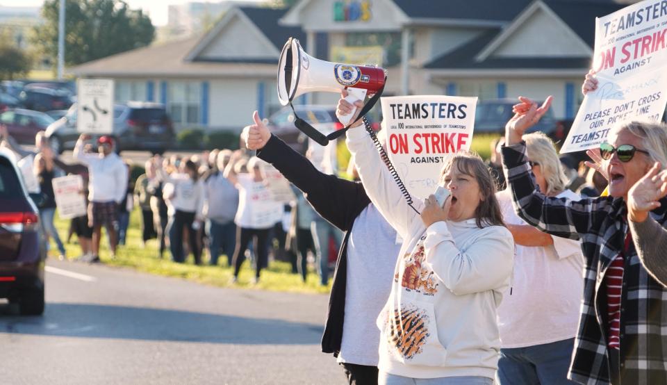 Bus drivers employed by Petermann Bus Company who drive for the Lakota Local School District in Butler County strike on Friday, Sept. 1, 2023 over contract stipulations they say make them more vulnerable to losing their jobs without recourse.