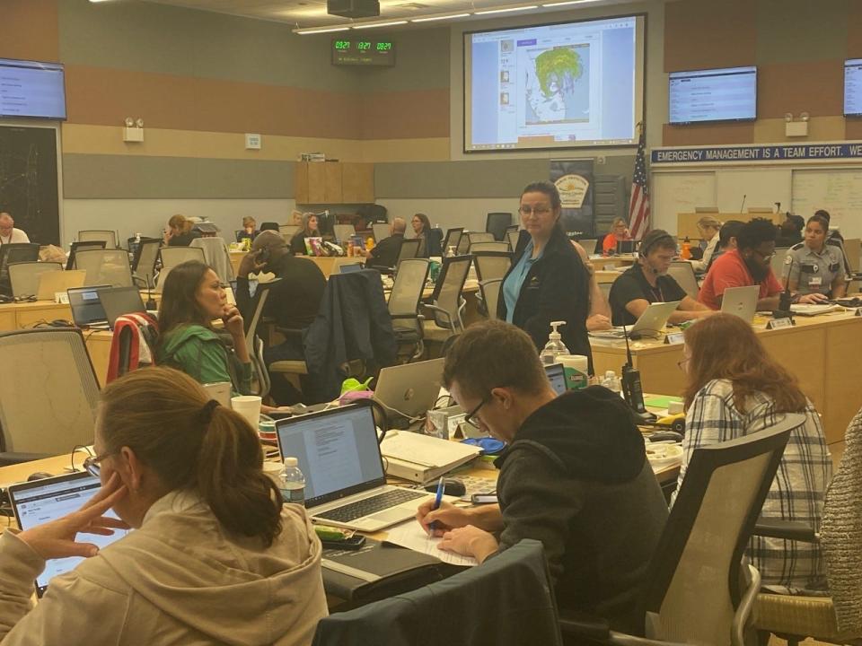 Volusia County officials work in the operations room at the Emergency Operations Center in Daytona Beach, Thursday, Sept. 29, 2022, as Tropical Storm Ian hits the area.