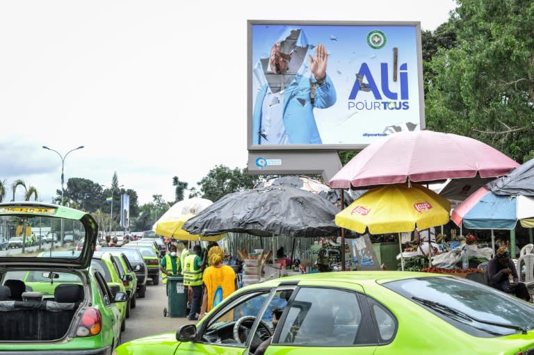 A torn campaign billboard of Gabon's ousted President Ali Bongo Ondimba in Libreville (-)