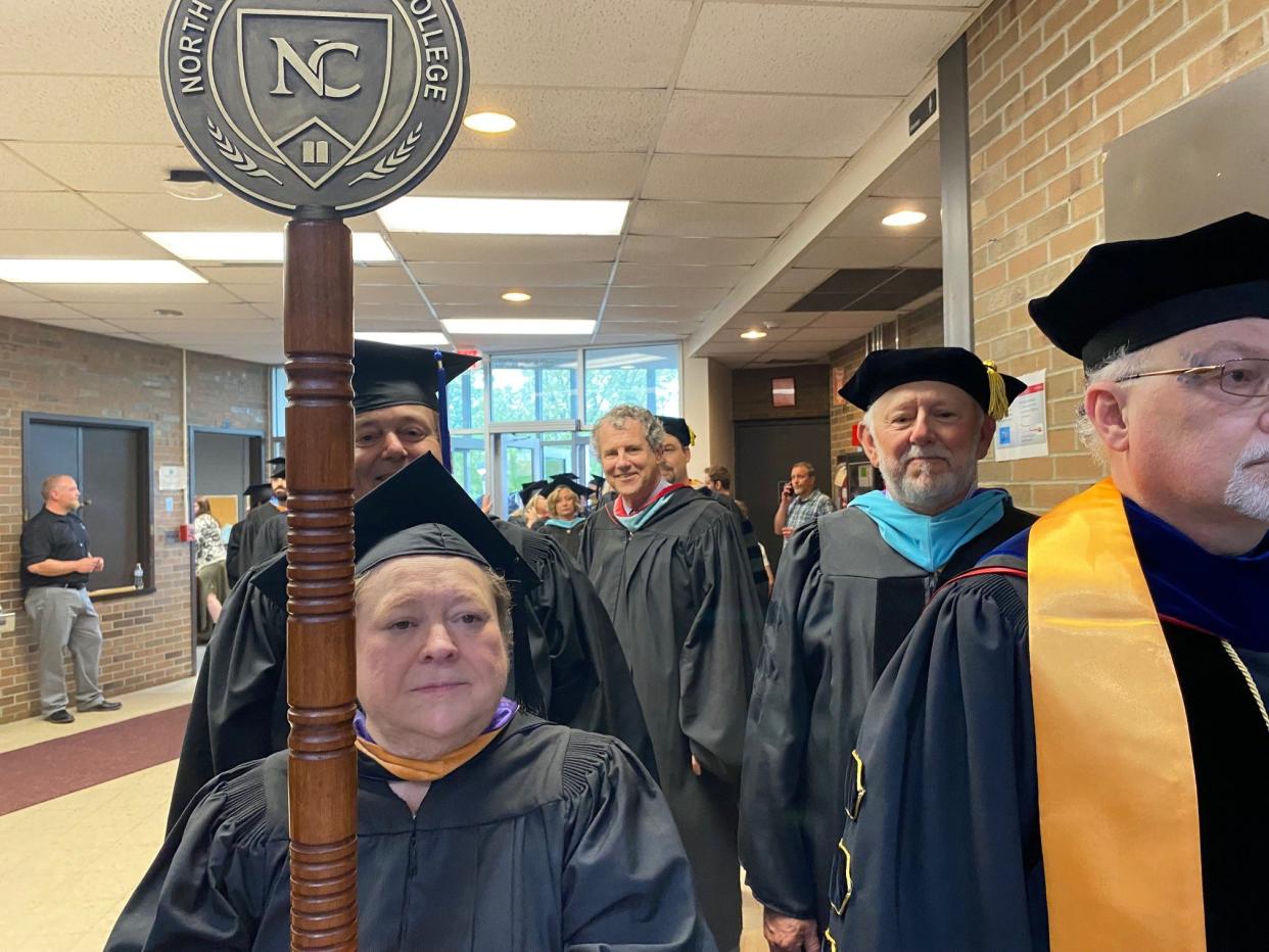 U.S. Sen. Sherrod Brown, a Mansfield native, center, gave the commencement address Friday night at North Central State College.