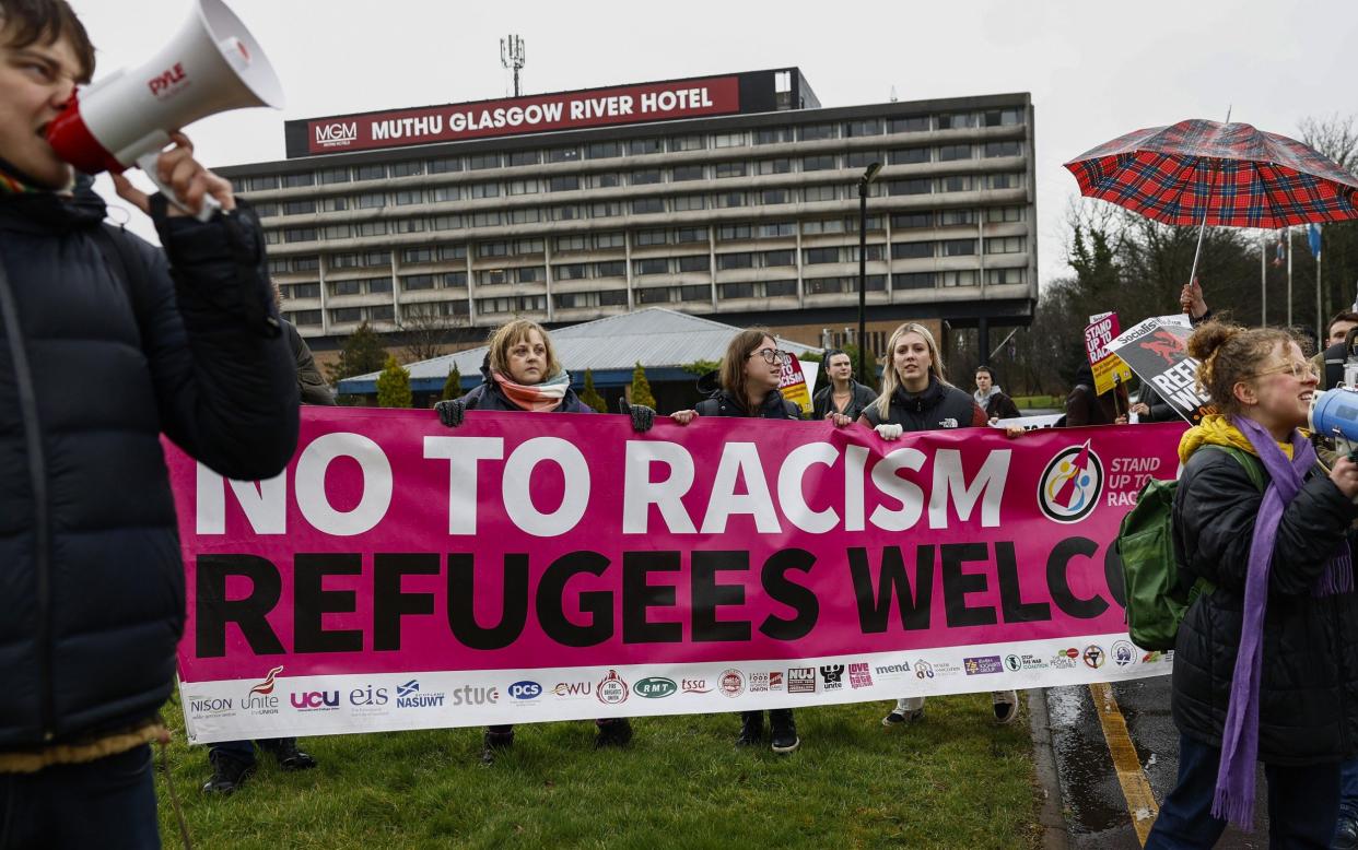 Stand Up to Racism along with trades councils and local residents hold a counter demonstration against the group Patriotic Alternative Muthu Glasgow Hotel which is housing refugees on March 12, 2023 in Erskine, Scotland.