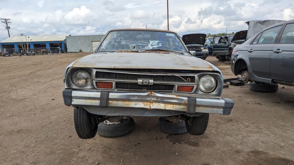 1980 datsun 210 wagon with 400k miles in colorado junkyard