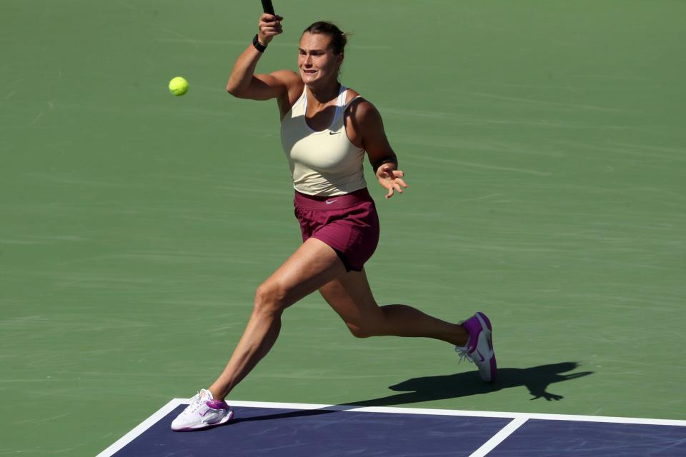 Aryna Sabalenka returns to Coco Gauff during their BNP Paribas Open quarterfinal match in Indian Wells, Calif., on Wednesday, March 15, 2023. 