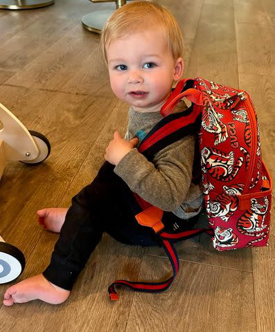 <p>Heather Rae El Moussa/Instagram</p> Heather Rae El Moussa's son Tristin wears red Gucci backpack