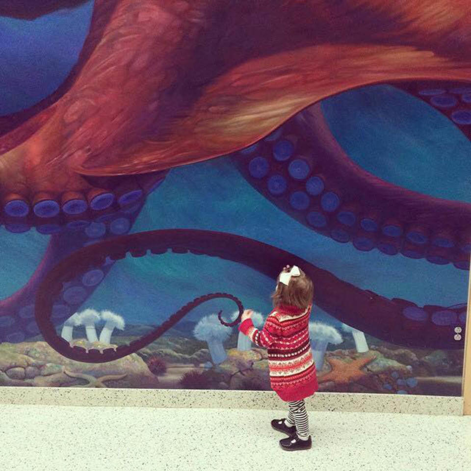 "This is my daughter Olive at the hospital the day she had a port placed in her chest so she could start chemo treatments for her brain tumor. <strong>She wasn't even 2 years old yet.</strong> There is no other monster like pediatric cancer, but she is fierce." -- Trista Tisdel Ray