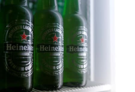 Botttles of Heineken lager beer are seen in a picture illustration inside a refrigerator in Vienna, Austria, October 18, 2016. REUTERS/Heinz-Peter Bader/File Photo