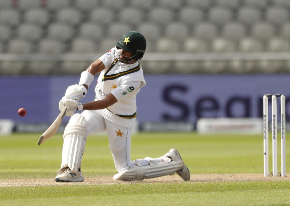 Pakistan's Shan Masood hits a six during the second day of the first cricket Test match between England and Pakistan at Old Trafford in Manchester, England, Thursday, Aug. 6, 2020. (Lee Smith/Pool via AP)