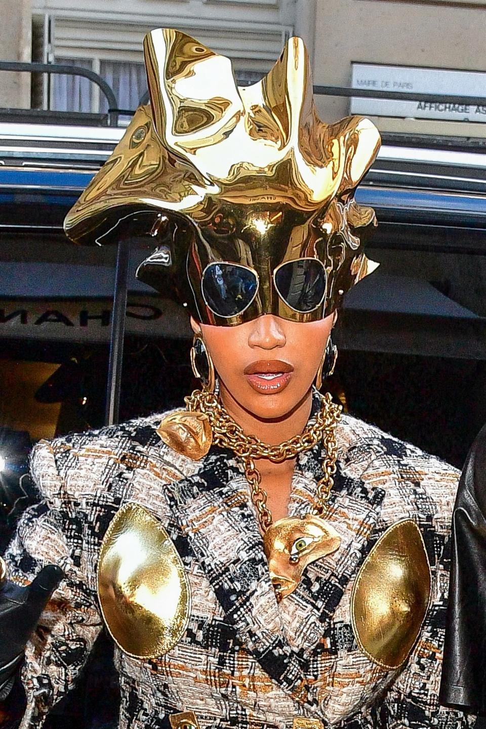 Close-up of Cardi's gold headpiece, with attached sunglasses