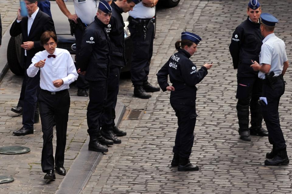 Belgium PM Di Rupo is seen at the site of a shooting in Brussels