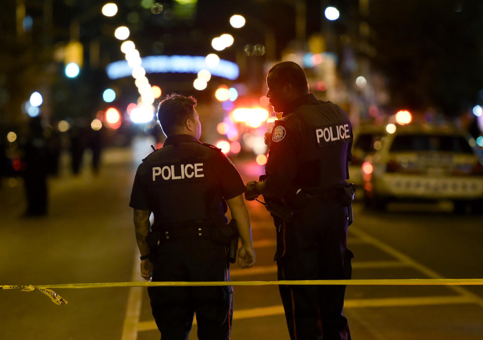 <p>Police work the scene of a shooting in Toronto on Sunday, July 22, 2018. (Photo: Nathan Denette/The Canadian Press via AP) </p>