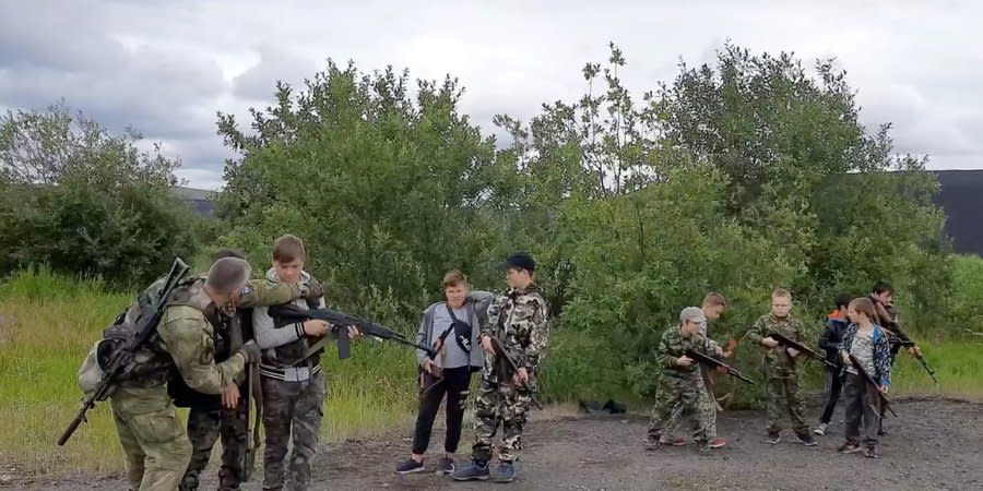 Russian children are taught to shoot from machine guns
