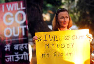 A woman holds a sign as she takes part in the #IWillGoOut rally, to show solidarity with the Women's March in Washington, along a street in Mumbai, India, January 21, 2017. REUTERS/Shailesh Andrade