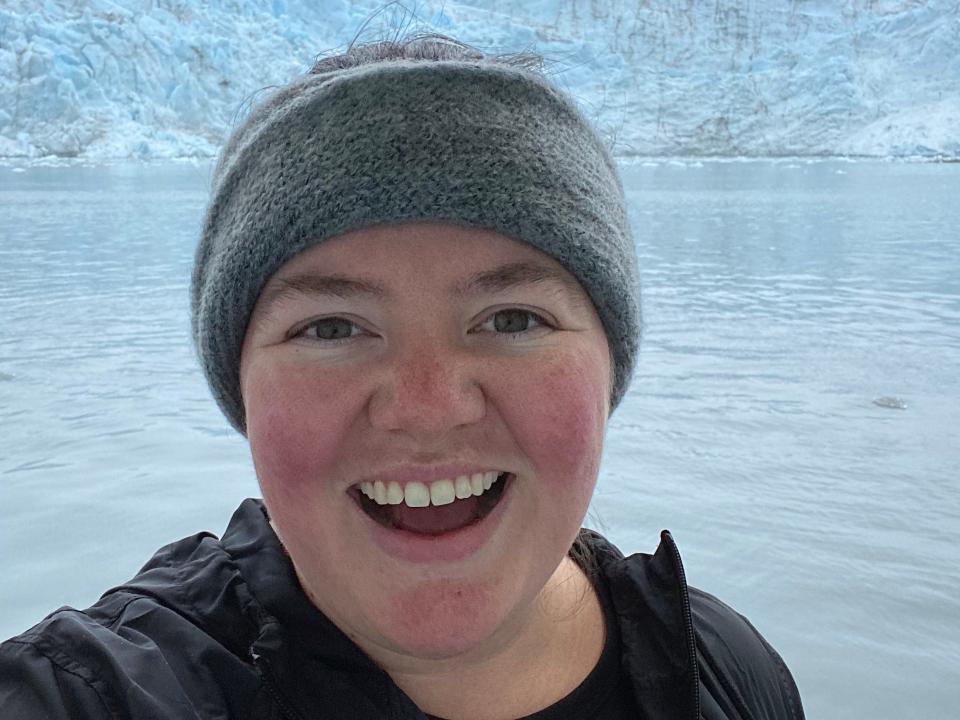 megan dubouis smiling bundled up in front of snow