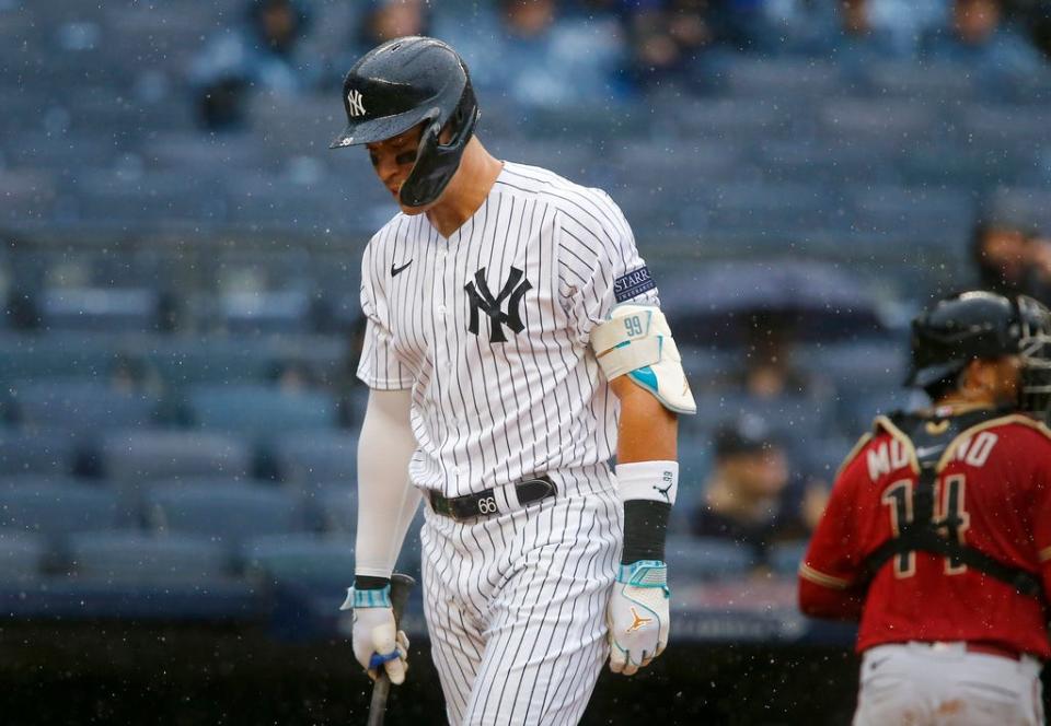 New York Yankees designated hitter Aaron Judge walks back to the dugout after being called out on strikes to end the fifth inning during a baseball game against the Arizona Diamondbacks, Sunday, Sept. 24, 2023, in New York. (AP Photo/John Munson)