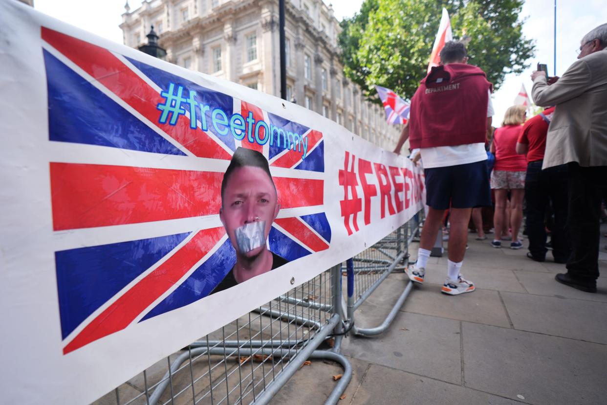 Protesters outside Downing Street in London protesting the reported arrest of Tommy Robinson. Tommy Robinson has been arrested under anti-terror laws, according to his verified X account. His detention follows a complaint over a film which was allegedly shown to the crowd at a march in central London on Saturday led by Mr Robinson, whose real name is Stephen Yaxley Lennon. Picture date: Sunday July 28, 2024.