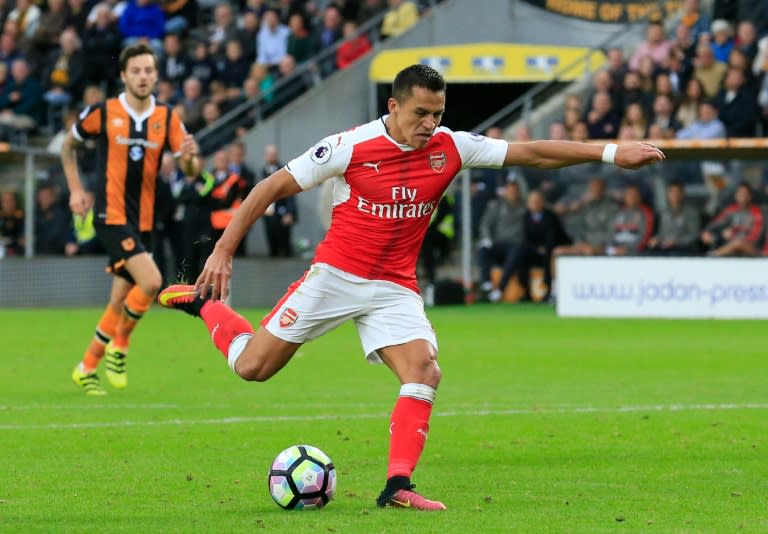 Arsenal's striker Alexis Sanchez shoots and scores during the English Premier League football match between Hull City and Arsenal at the KCOM Stadium on September 17, 2016