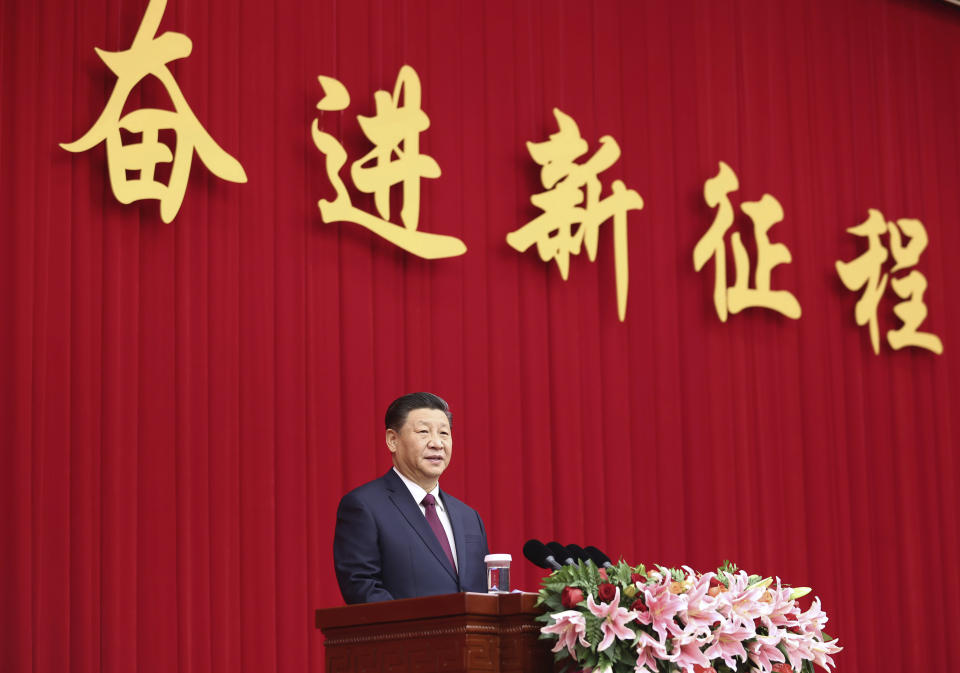 In this photo released by China's Xinhua News Agency, Chinese President Xi Jinping speaks at a New Year gathering hosted by the Chinese People's Political Consultative Conference (CPPCC) in Beijing, Thursday, Dec. 31, 2020. President Xi Jinping said in a New Year address that China has made major progress in developing its economy and eradicating rural poverty over the past year despite the coronavirus pandemic. (Ju Peng/Xinhua via AP)