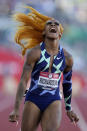 Sha'Carri Richardson celebrates after winning the women's 100-meter run at the U.S. Olympic Track and Field Trials Saturday, June 19, 2021, in Eugene, Ore. (AP Photo/Ashley Landis)