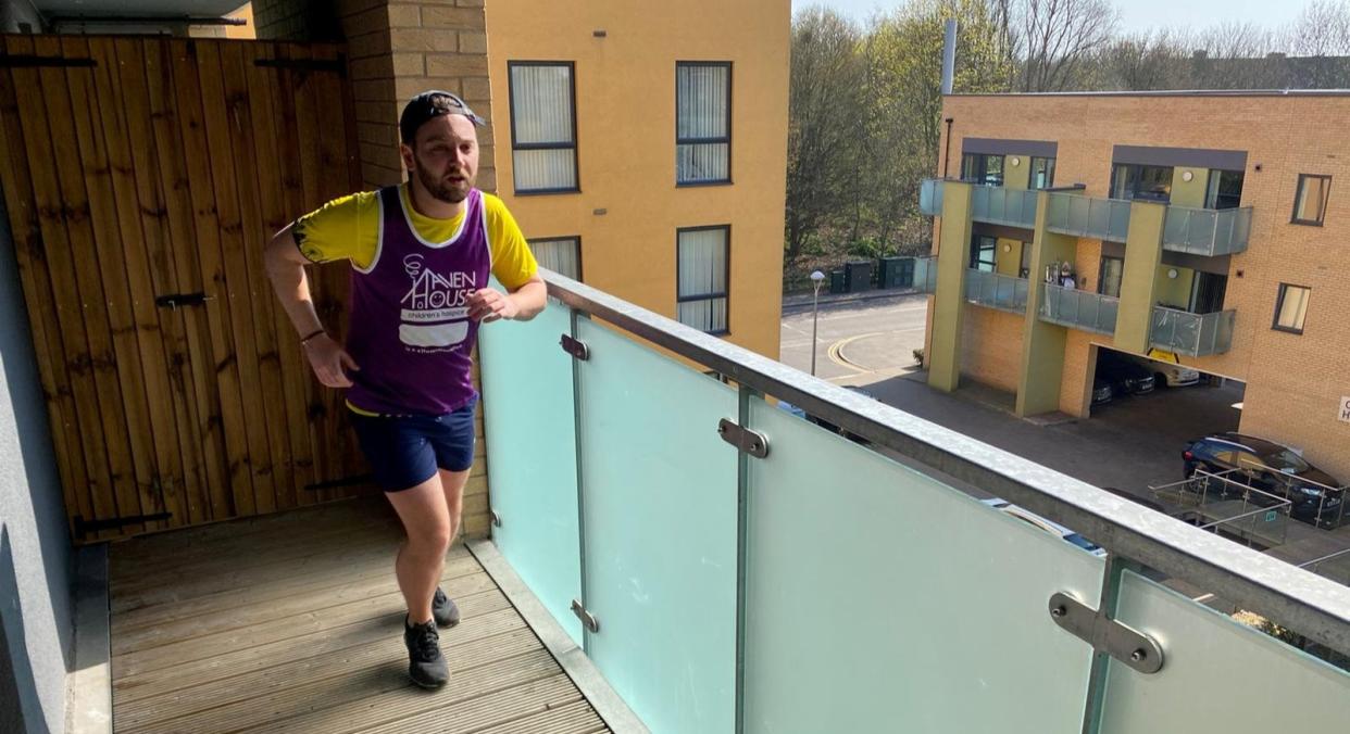 A runner has completed a half-marathon in self-isolation by jogging the length of his balcony 7,000 times (SWNS)