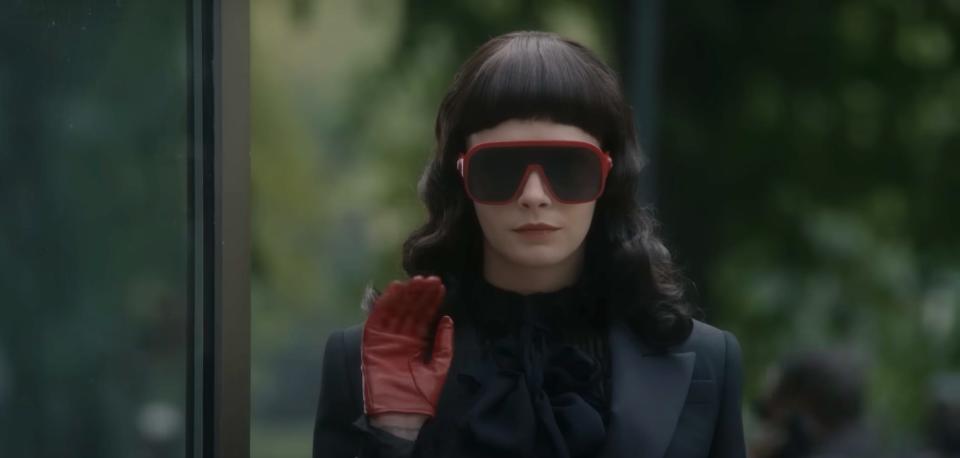 Cara Delevingne wearing red sunglasses in "American Horror Story: Delicate."