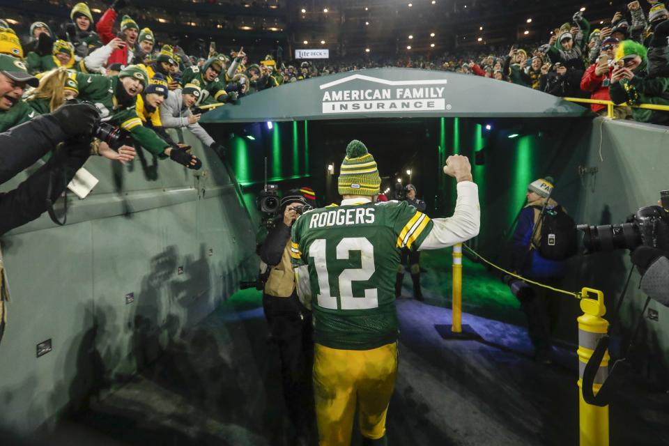 Green Bay Packers' Aaron Rodgers celebrates as he walks off the field after an NFL divisional playoff football game against the Seattle Seahawks Sunday, Jan. 12, 2020, in Green Bay, Wis. The Packers won 28-23 to advance to the NFC Championship. (AP Photo/Mike Roemer)