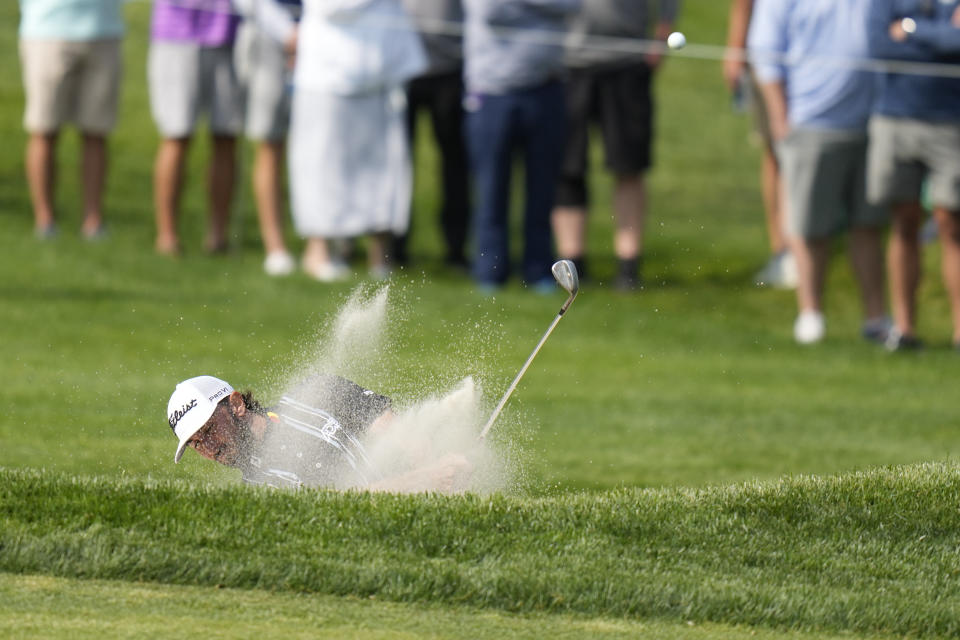 Max Homa hits from the bunker on the 17th hole during the second round of the PGA Championship golf tournament at Oak Hill Country Club on Friday, May 19, 2023, in Pittsford, N.Y. (AP Photo/Seth Wenig)