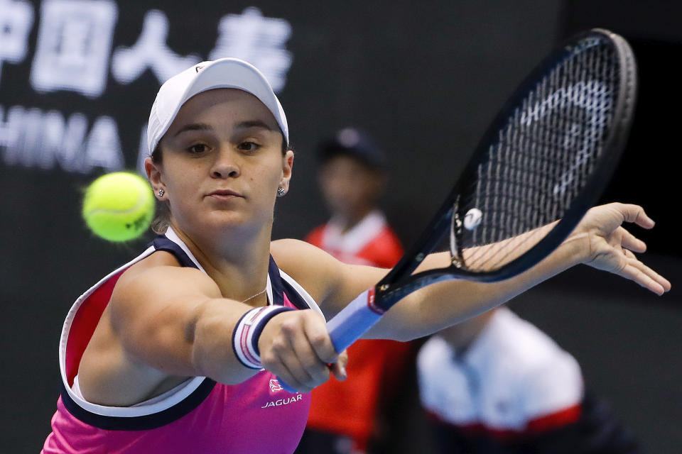 FILE - In this Oct. 4, 2019, file photo, Ashleigh Barty, of Australia, hits a backhand shot against Petra Kvitova, of the Czech Republic, during a women's singles quarterfinal match in the China Open tennis tournament at the Diamond Court in Beijing. Barty is ready to cap off the most successful season of her career with a first appearance in the year-end WTA Finals. (AP Photo/Mark Schiefelbein, File)