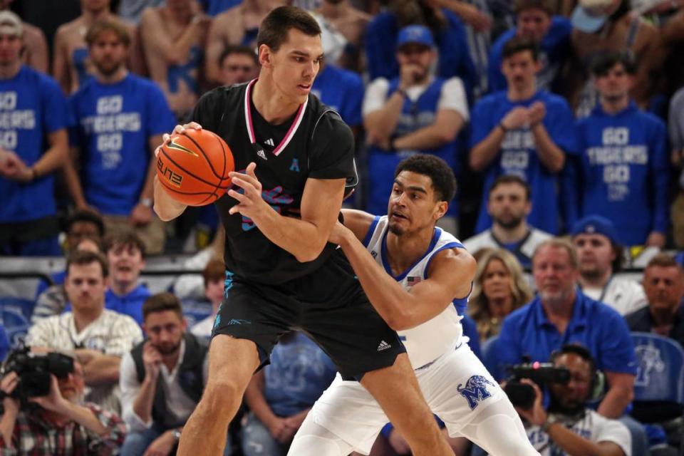 Florida Atlantic Owls center Vladislav Goldin (50) handles the ball as Memphis Tigers forward Nicholas Jourdain (2) defends during the first half at FedExForum on Feb. 25, 2024.