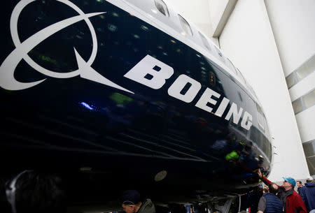 FILE PHOTO: Employees are pictured as the first Boeing 737 MAX 7 is unveiled in Renton, Washington, U.S. February 5, 2018. REUTERS/Jason Redmond/File Photo