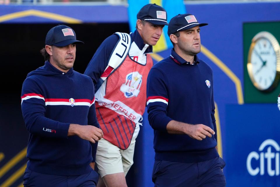 Sep 30, 2023; Rome, ITA; Team USA golfers Brooks Koepka (left) and Scottie Scheffler (right) walk the first hole during day two foursomes round for the 44th Ryder Cup golf competition at Marco Simone Golf and Country Club. Mandatory Credit: Adam Cairns-USA TODAY Sports