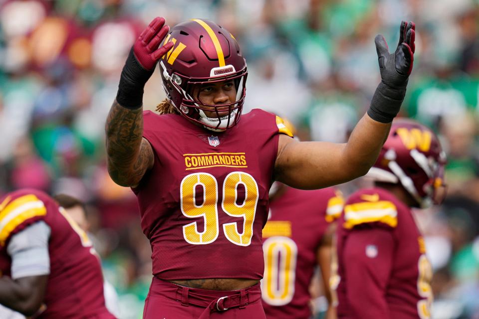 Chase Young #99 of the Washington Commanders reacts in the first quarter of a game against the Philadelphia Eagles at FedExField on October 29, 2023 in Landover, Maryland.