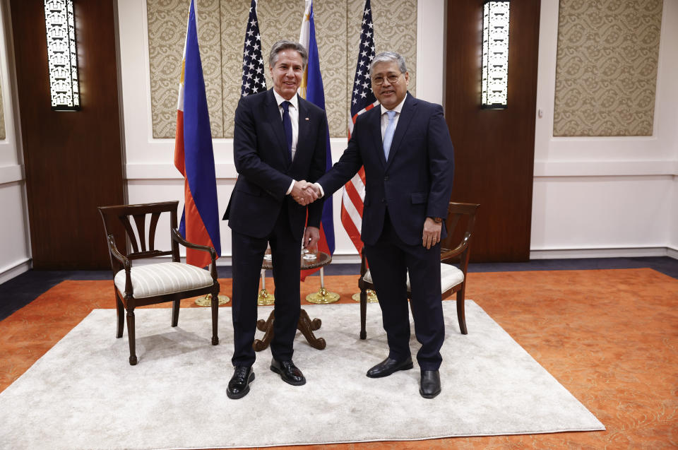 U.S. Secretary of State Antony Blinken, left, shakes hands with Philippines' Secretary of Foreign Affairs Enrique Manalo at the Sofitel Hotel in Manila, Philippines Tuesday, March 19, 2024. (Evelyn Hockstein/Pool Photo via AP)