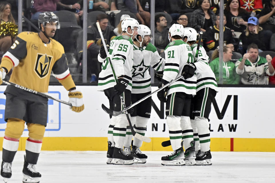 The Dallas Stars celebrate a goal against the Vegas Golden Knights during the second period of an NHL hockey game Tuesday, Oct. 17, 2023, in Las Vegas. (AP Photo/David Becker)