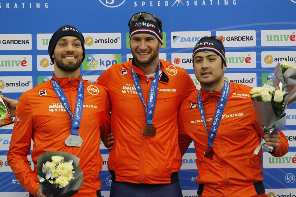 FILE - From left to right, Netherlands' silver medalist Kjeld Nuis, gold medalist Thomas Krol and bronze medalist Kai Verbij pose during a medal ceremony after the men 1000-meter race of the speedskating World Cup at the Alau Ice Palace in Nur-Sultan, Kazakhstan, Dec. 7, 2019. Krol believed he was going to the Olympics four years ago. The speedskater finished third at the Dutch trials, and then politics intervened. The national federation named Verbij to the team for Pyeongchang. Verbij was injured at the trials and unable to compete in the 1,000 meters, but he was chosen over Krol. (AP Photo/Stas Filippov, File)