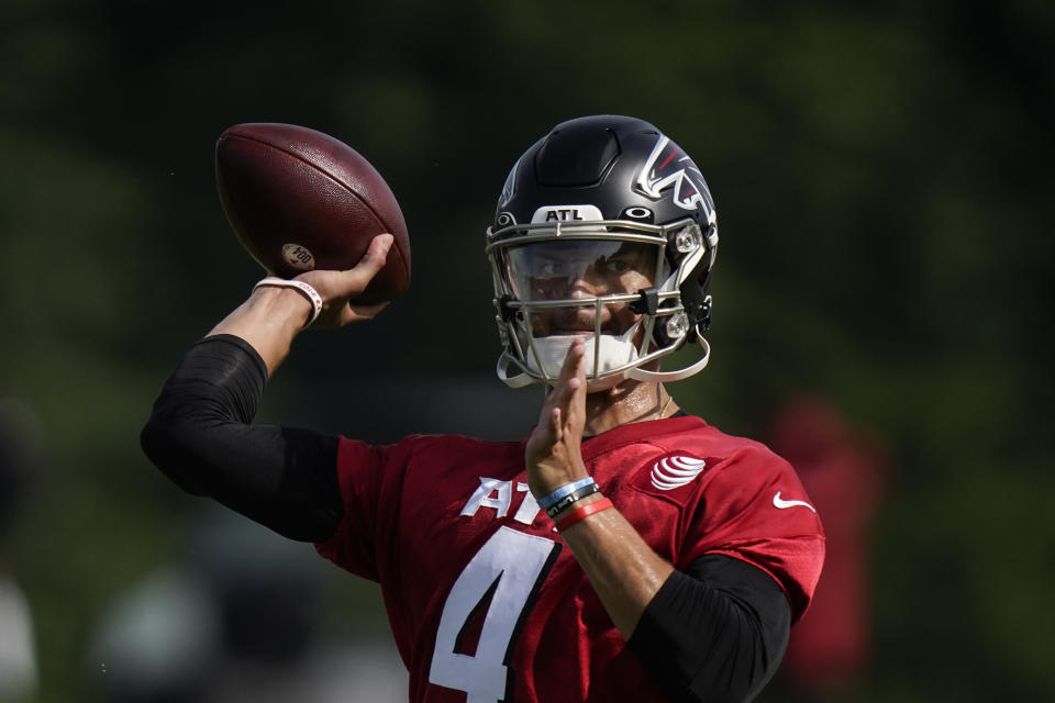 Atlanta Falcons quarterback Desmond Ridder takes part in drills at the NFL football team's practice facility on Wednesday, July 27, 2022, in Flowery Branch, Ga. (AP Photo/Brynn Anderson)