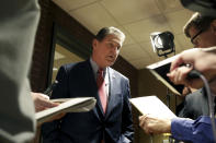FILE- In this Nov. 1, 2018, file photo, Sen. Joe Manchin speaks to reporters after a debate with Patrick Morrisey in Morgantown, W.Va. Manchin goes after a second full term in the Senate on Tuesday, Nov. 6, against comparative political newcomer Patrick Morrisey, the two-term Republican state attorney general hoping to ride plenty of attention from Trump in recent months to victory. (AP Photo/Raymond Thompson, File)