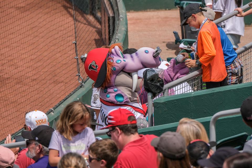 Big Lug signs autographs on baseballs during the Lugnuts game on Father's Day Sunday, June 18, 2023.