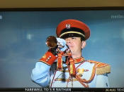 A bugler plays the “Last Post” during the funeral ceremony. (Photo: TV screenshot)