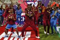 Cricket - England v West Indies - World Twenty20 cricket tournament final - Kolkata, India - 03/04/2016. West Indies players celebrate with the trophy after winning the final. REUTERS/Adnan Abidi