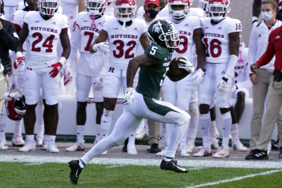 Michigan State wide receiver Jayden Reed (5) runs down the sidelines for a touchdown during the first half of an NCAA college football game against Rutgers, Saturday, Oct. 24, 2020, in East Lansing, Mich. (AP Photo/Carlos Osorio)