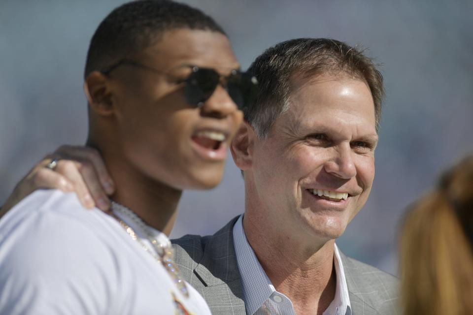Jaguars player DJ Chark with general manager Trent Baalke on the sidelines before the start of Sunday&#39;s game against the Colts. Fans upset over team owner Shad Khan&#39;s decision to retain the team&#39;s general manager Trent Baalke after the firing of head coach Urban Meyer. Sunday&#39;s game against the Colts. The Jacksonville Jaguars hosted the Indianapolis Colts at TIAA Bank Field in Jacksonville, Florida for the Jaguars final game of the season Sunday, January 9, 2022. [Bob Self/Florida Times-Union]